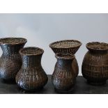 FIVE ORIENTAL BALUSTER SHAPED BASKET WORK VASES. H 21cms.