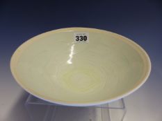 A QINGBAI BOWL, THE INTERIOR INCISED WITH STYLISED WAVES. Dia. 18.5cms. WITH CLOTH COVERED BOX