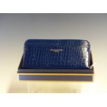 A ASPINAL OF LONDON MIDNIGHT BLUE PATENT CROCODILE EFFECT LEATHER PURSE COMPLETE WITH BOX. L 20cm