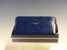 A ASPINAL OF LONDON MIDNIGHT BLUE PATENT CROCODILE EFFECT LEATHER PURSE COMPLETE WITH BOX. L 20cm
