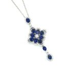 AN 18ct WHITE GOLD HALLMARKED SAPPHIRE AND DIAMOND ARTICULATING PENDANT AND CHAIN. PENDANT DROP