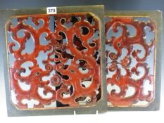 A PAIR OF CHINESE RED LACQUER PANELS PIERCED AND CARVED WITH PAIRS OF DRAGONS MOUTH TO MOUTH WITH
