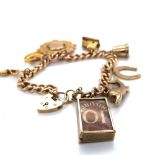 A 9ct HALLMARKED GOLD CHARM BRACELET COMPLETE WITH PADLOCK CLASP AND SAFETY CHAIN AND HALLMARKED 9ct