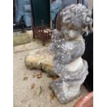 A WEATHERED CHERUB FIGURE ON A STONE BASE HEIGHT 93 cm