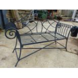 A WROUGHT IRON GARDEN BENCH