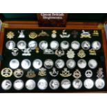 A MAHOGANY CASED SET OF FIFTY TWO SILVER MEDALLIONS CELEBRATING GREAT BRITISH REGIMENTS, EACH WITH