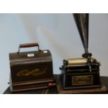 AN EDISON GEM PHONOGRAPH, THE PLAYING ARM FOR THE CYLINDRICAL DISCS TAKING A BLACK AND GILT HORN,