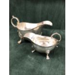 A SILVER TRIPOD SAUCE BOAT BY HENRY WILKINSON & Co., LONDON 1905, ITS RIM BEADED TOGETHER WITH