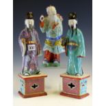 A PAIR OF 19th C. CHINESE FIGURES, POSSIBLY FUXING AND LUXING, EACH STANDING ON PLINTHS ONE IN A