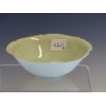 A QINGBAI BOWL WITH A SIX PETAL RIM. Dia. 13cms. WITH A CLOTH COVERED BOX.