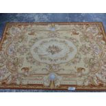 AN AUBUSSON DESIGN NEEDLEWORK RUG. 270 x 173cms