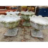 A SET OF FOUR PEDESTAL TERRACE URNS ON SQUARE PLINTH BASES 46 cm DIAMETER