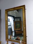 AN EARLY 19th C. FRENCH RECTANGULAR MIRROR WITHIN A GILT FRAME WITH FOLIAGE MOULDINGS AT THE CORNERS