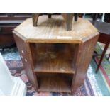 AN ART DECO OAK COFFEE TABLE, THE CANTED PANEL CORNERS SUPPORTING TWO TIERS OF SHELVES.   W 56 x D