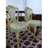 A PAIR OF VICTORIAN CARVED PAINTED SHOW FRAME SIDE CHAIRS.