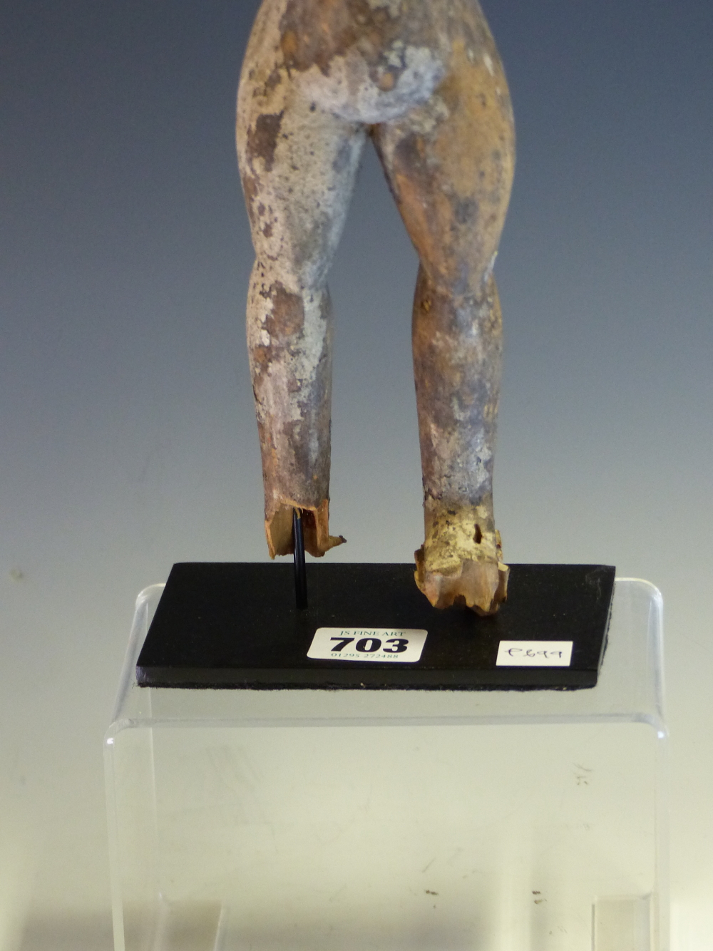 AN ASHANTI CARVED WOOD FERTILITY DOLL STANDING WITH ARMS OUT STRETCHED, THE SURFACE APPLIED WITH - Image 4 of 6