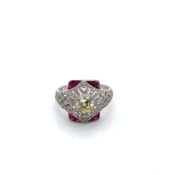 AN OLD CUT DIAMOND AND FANCY CUT RUBY ART DECO STYLE OPEN WORK RING. UNHALLMARKED, STAMPED PLAT,