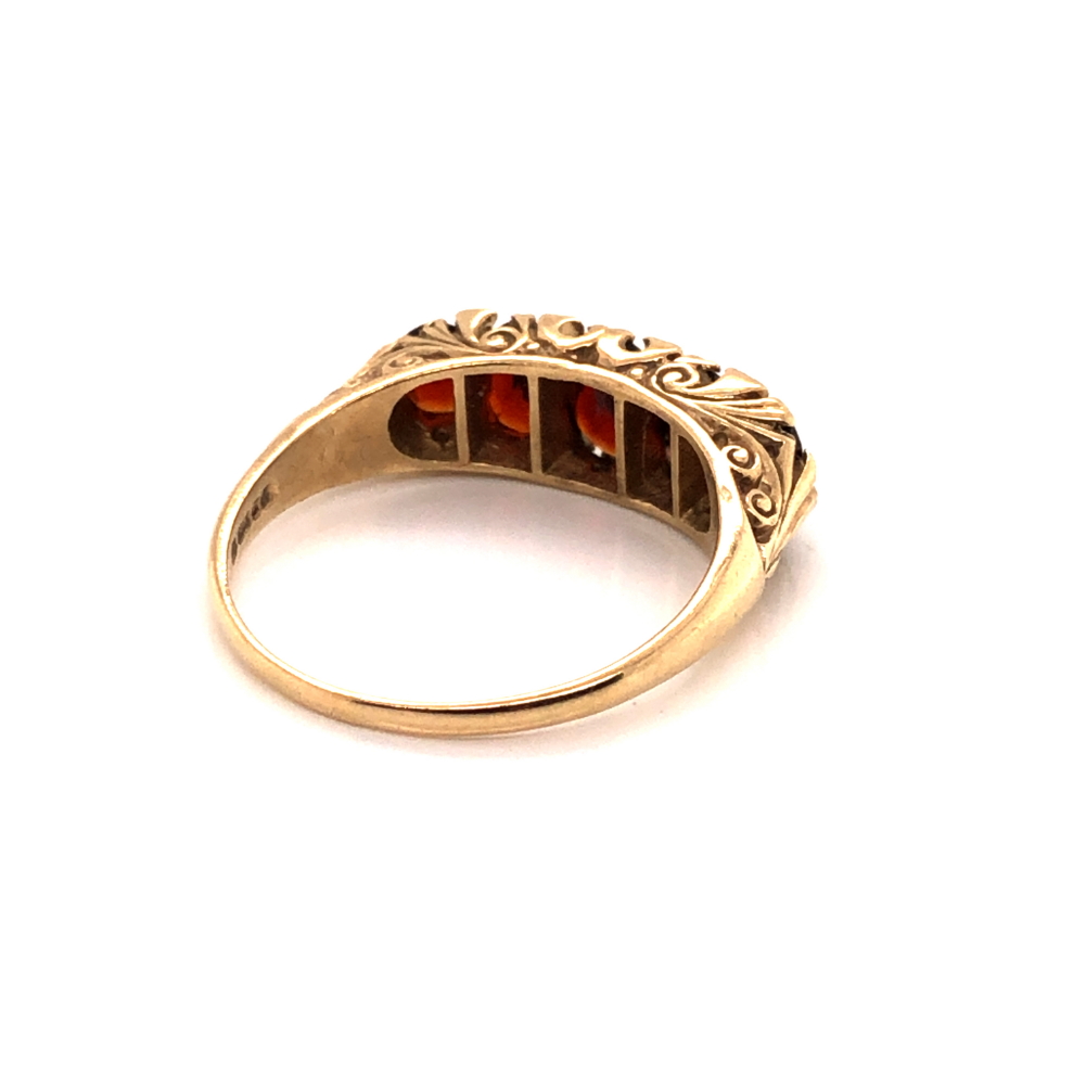 A VINTAGE GARNET AND DIAMOND GRADUATED CARVED HALF HOOP RING. DATED 1979, LONDON. FINGER SIZE Y. - Image 2 of 3