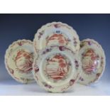 A SET OF FOUR LATE 18th/EARLY 19th C. CREAMWARE FEATHER EDGED PLATES PAINTED CENTRALLY IN IRON RED