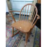 AN ERCOL ROCKING CHAIR.