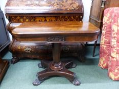 AN EARLY VICTORIAN ROSEWOOD FOLD OVER CARD TABLE