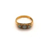 A VINTAGE 18ct HALLMARKED GOLD GRADUATED THREE STONE OPAL AND DIAMOND CARVED HALF HOOP RING.