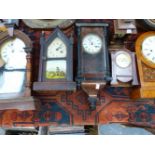 A SMALL GROUP OF VARIOUS AMERICAN MANTLE CLOCKS TOGETHER WITH A WALL CLOCK.