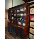 A LARGE MAHOGANY SHOP/ CHEMISTS DISPLAY CABINET WITH SHELVES INTERIOR BEHIND GLAZED DOORS. W 185 x