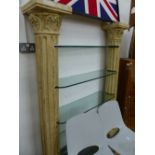 AN INTERESTING CORINTHIAN COLUMN SUPPORTED DISPLAY SHELVES.