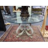 AN INTERESTING MID CENTURY CAST ALLOY AND GLASS TABLE- THE BASE CAST TO SIMULATE BENTWOOD IN THE
