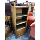 AN ARTS AND CRAFTS OAK FOUR SHELF OPEN BOOK CASE WITH BAR HANDLES RAISED ABOVE THE NARROW SIDES