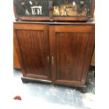 A 19th CENTURY MAHOGANY TWO DOOR SIDE CABINET. H 110 X W 112 X D 55cms.