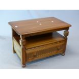 AN ERCOL ELM TRIANGULAR FLAP TOPPED COFFEE TABLE. W 112 x D 74 x h 47cms.