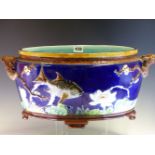 A 19th C. HOLDCROFT MAJOLICA OVAL PLANTER, THE BLUE EXTERIOR WITH FISH AND WATER LILIES IN RELIEF,