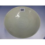 A QINGBAI BOWL INCISED WITH TWO LOTUS FLOWERS GROWING AMONGST STYLISED WAVES. Dia. 18cms. WITH A