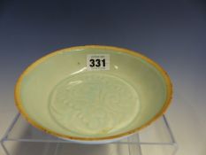 A QINGBAI BOWL, THE CAVETTO ENCLOSING A ROUNDEL OF INCISED FLOWERS AND THEIR FOLIAGE. Dia. 14cms.