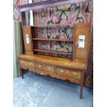 A 19th C. AND LATER OAK DRESSER, THE OPEN BACK WITH THREE SHELVES FLANKED BY TWO CUPBOARDS WITH