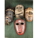 THREE NEPALESE CARVED WOODEN MASKS TOGETHER WITH A YAO WOODEN MASK, THE LARGEST MOUNT WITH HAIR