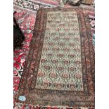 AN ANTIQUE PERSIAN TRIBAL RUG. 190 x 109cms