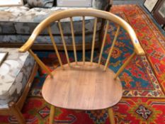 A PAIR OF ERCOL PALE ELM ARMCHAIRS