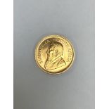 A 1974 22ct GOLD FULL KRUGGERAND BULLION COIN. WEIGHT 34grms.