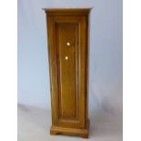 AN ERCOL ELM CUPBOARD, THE CHIP CARVED PANELLED DOOR ENCLOSING ADJUSTABLE SHELVES. W 40 x D 24 x H