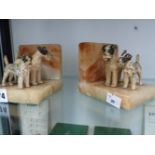 A PAIR OF ARC DECO BOOK ENDS WITH AIRDALE TERRIERS