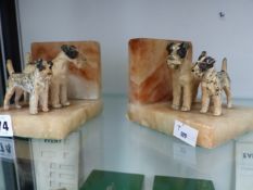 A PAIR OF ARC DECO BOOK ENDS WITH AIRDALE TERRIERS
