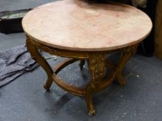 A PINK MARBLE TOPPED FRENCH STYLE GILT WOOD CIRCULAR COFFEE TABLE, THE APRON CARVED WITH FOLIAGE,