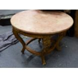 A PINK MARBLE TOPPED FRENCH STYLE GILT WOOD CIRCULAR COFFEE TABLE, THE APRON CARVED WITH FOLIAGE,