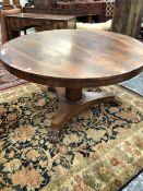 A WILLIAM IV AND LATER ROSEWOOD BREAKFAST TABLE, THE CIRCULAR TOP ON AN OCTAGONAL COLUMN FLARING
