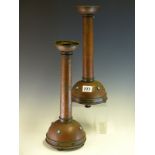 A PAIR OF ARTS AND CRAFTS COPPER CANDLESTICKS MOUNTED WITH WHITE METAL BANDS AND TURQUOISE