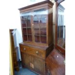 AN EARLY 19th C. MAHOGANY SECRETAIRE BOOKCASE, THE UPPER HALF WITH GLAZED DOORS OVER SHELVES, THE