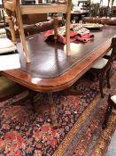 A MAHOGANY BOARD ROOM TABLE WITH LEATHER INSET ROUNDED RECTANGULAR TOP ON TWO BALUSTER COLUMNS, EACH